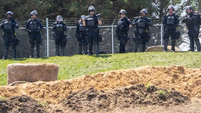 Authorities respond as hundreds of activists stormed a beagle farm