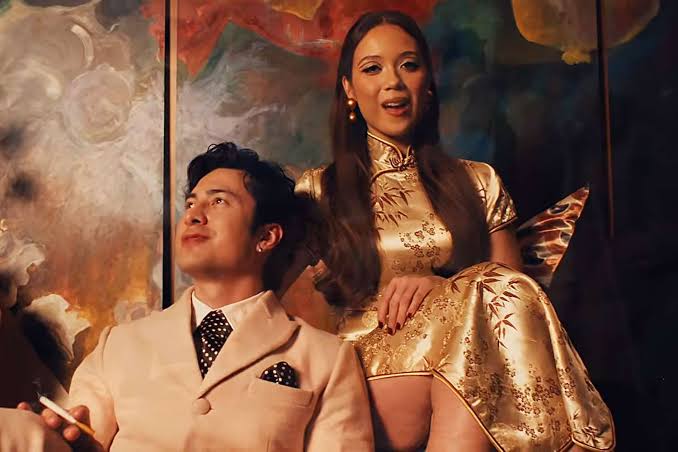 Hudson Williams gets slapped with a fish in Laufey’s ‘Madwoman’ music video