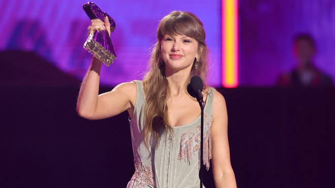 Taylor Swift wins big at iHeartRadio awards, feels 'happy and strong'