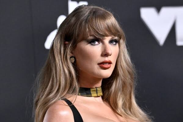 Lawsuit says Taylor Swift’s ‘Showgirl’ pose comes too close to the work of a real one