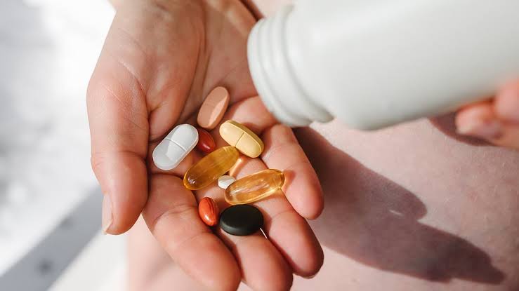 From skin changes to headaches... the six signs you're taking too many vitamins