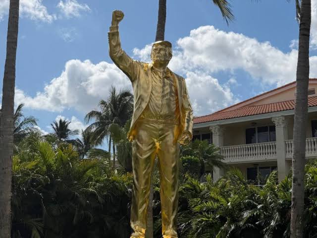 Donald Trump unveils gaudy golden statue of himself before $20 million event
