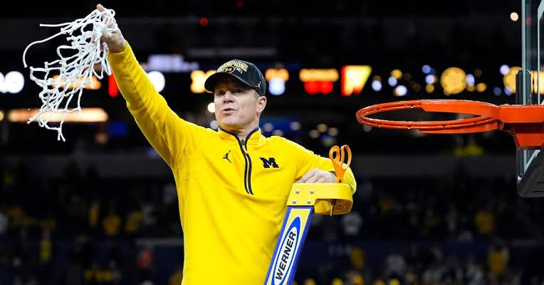 Michigan AD Warde Manuel announces Dusty May extension during championship parade