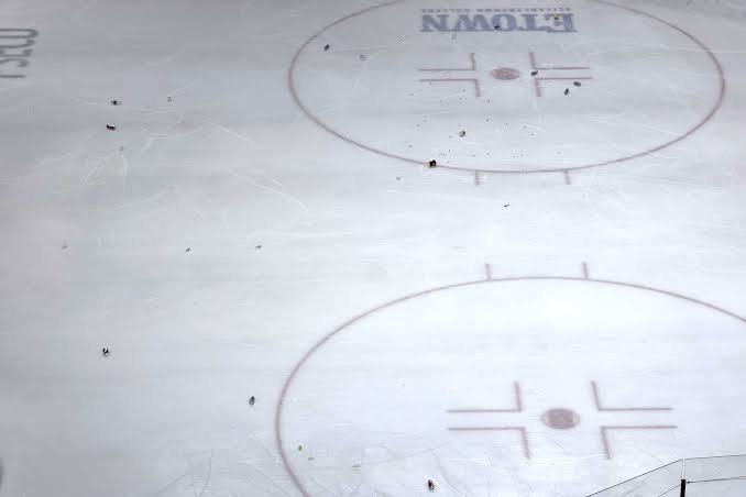 Hershey Bears fans throw debris on the ice after jumbotron replay appears to show Rutger McGroarty’s overtime game-winner didn’t go in