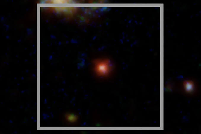 This tiny red dot may have solved the mystery of strange signals in deep space, at the dawn of the Universe