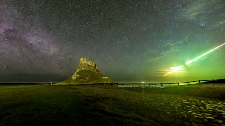 'We all screamed when it happened': Bright-green fireball meteor caught exploding over famous Viking raid site in UK