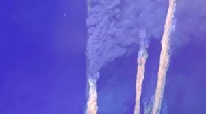 3 miles down, deep-sea robots discovered an incredibly hostile habitat with scorching 400°C waters, smoking black chimneys and – somehow – life...