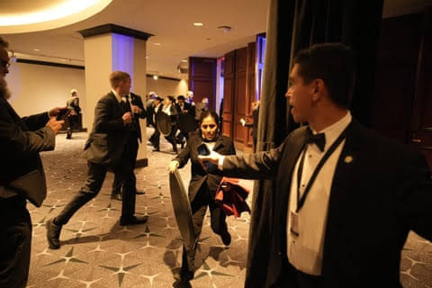 Chaos as Trump whisked from Washington press dinner after shots fired – in pictures