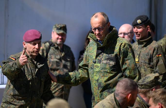 Merz shrugs off Trump clash over troops, trade